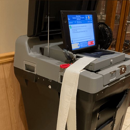 Poll tapes being printed by a tabulator