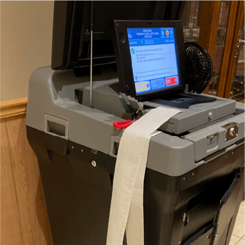 Poll tapes being printed by a tabulator